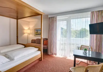 Ein Bett oder Betten in einem Zimmer der Unterkunft Hotel Mayer