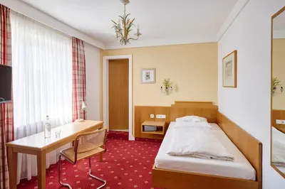Ein Bett oder Betten in einem Zimmer der Unterkunft Hotel Mayer