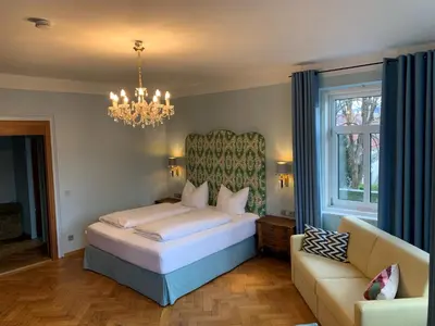 Ein Bett oder Betten in einem Zimmer der Unterkunft Hotel Kolbergarten