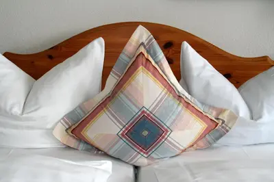 Ein Bett oder Betten in einem Zimmer der Unterkunft Hotel Kolbergarten