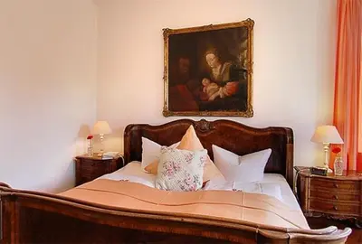 Ein Bett oder Betten in einem Zimmer der Unterkunft Hotel Kolbergarten