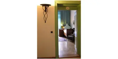 Ein Bett oder Betten in einem Zimmer der Unterkunft Hotel Kolbergarten
