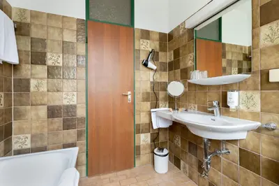 Ein Badezimmer in der Unterkunft Hotel Kolbergarten