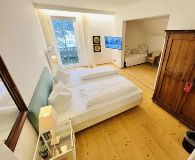 Ein Bett oder Betten in einem Zimmer der Unterkunft Hotel Kolbergarten