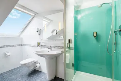 Ein Badezimmer in der Unterkunft Hotel Asemann Planegg