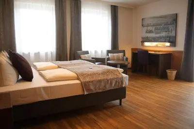 Ein Bett oder Betten in einem Zimmer der Unterkunft Boutique Hotel Beckenlehner