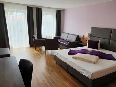 Ein Bett oder Betten in einem Zimmer der Unterkunft Boutique Hotel Beckenlehner