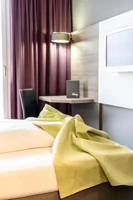 Ein Bett oder Betten in einem Zimmer der Unterkunft Hotel Demas City