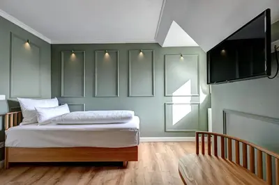 Ein Bett oder Betten in einem Zimmer der Unterkunft Hotel Uhland