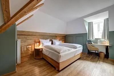 Ein Bett oder Betten in einem Zimmer der Unterkunft Hotel Uhland