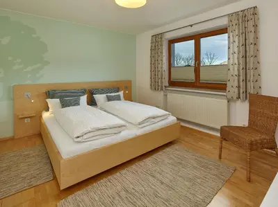 Ein Bett oder Betten in einem Zimmer der Unterkunft Ferienwohnungen Evi Huber