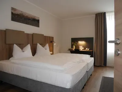 Ein Bett oder Betten in einem Zimmer der Unterkunft Anderschitz Landhotel