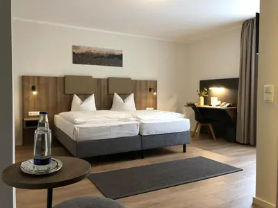 Ein Bett oder Betten in einem Zimmer der Unterkunft Anderschitz Landhotel