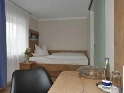 Ein Bett oder Betten in einem Zimmer der Unterkunft Anderschitz Landhotel
