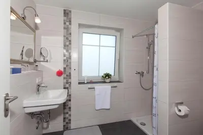 Ein Badezimmer in der Unterkunft Ferienwohnungen KUR-ECK