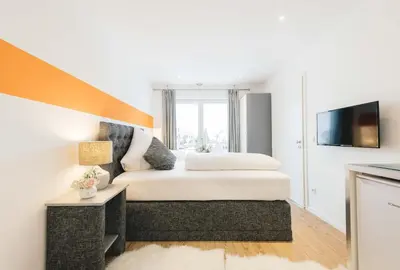 Ein Bett oder Betten in einem Zimmer der Unterkunft Unique Inn