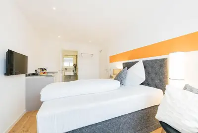 Ein Bett oder Betten in einem Zimmer der Unterkunft Unique Inn