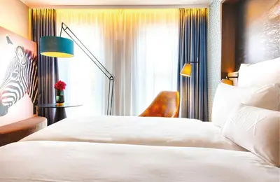 Ein Bett oder Betten in einem Zimmer der Unterkunft NYX Hotel Munich by Leonardo Hotels