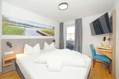 Ein Bett oder Betten in einem Zimmer der Unterkunft Hotel 17 Seen