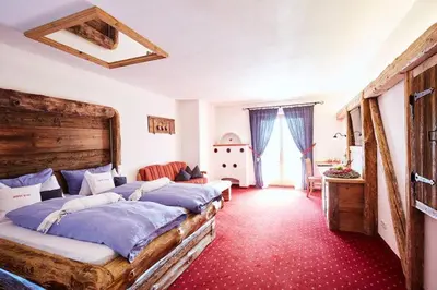 Ein Bett oder Betten in einem Zimmer der Unterkunft Hotel Garni Eder