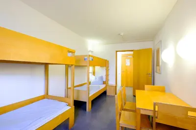 Ein Bett oder Betten in einem Zimmer der Unterkunft Internationales Jugendgästehaus Dachau