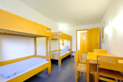 Ein Bett oder Betten in einem Zimmer der Unterkunft Internationales Jugendgästehaus Dachau