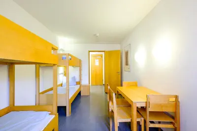 Ein Bett oder Betten in einem Zimmer der Unterkunft Internationales Jugendgästehaus Dachau