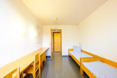 Ein Bett oder Betten in einem Zimmer der Unterkunft Internationales Jugendgästehaus Dachau