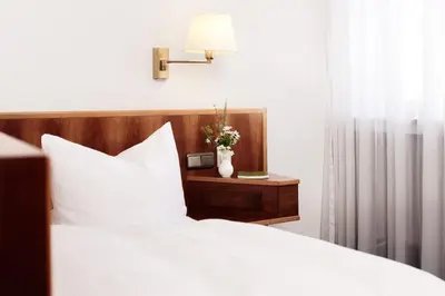 Ein Bett oder Betten in einem Zimmer der Unterkunft Hotel Burgmeier