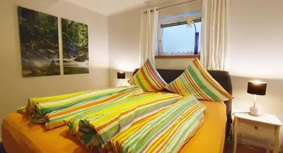 Ein Bett oder Betten in einem Zimmer der Unterkunft Ferienwohnung Hilpert