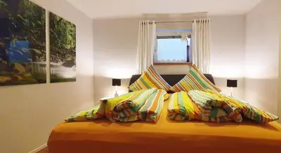 Ein Bett oder Betten in einem Zimmer der Unterkunft Ferienwohnung Hilpert