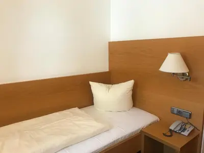 Ein Bett oder Betten in einem Zimmer der Unterkunft Hotel Alte Post