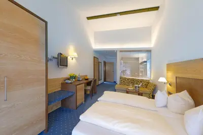 Ein Bett oder Betten in einem Zimmer der Unterkunft Hotel Alte Post