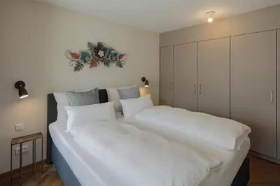 Ein Bett oder Betten in einem Zimmer der Unterkunft DD Suites Serviced Apartments