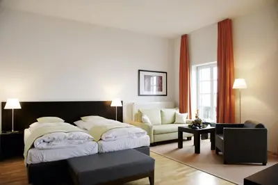 Ein Bett oder Betten in einem Zimmer der Unterkunft Seeresidenz Alte Post