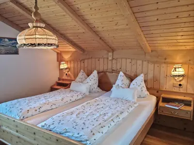 Ein Bett oder Betten in einem Zimmer der Unterkunft Ferienhaus Alpenzauber