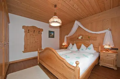 Ein Bett oder Betten in einem Zimmer der Unterkunft Ferienhaus Alpenzauber