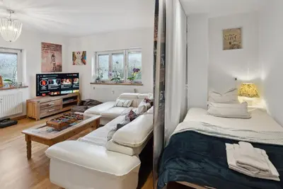 Ein Bett oder Betten in einem Zimmer der Unterkunft MAKE FEWO Kellermann Barrierefreie Ferienwohnung Garten Kamin 30 min München