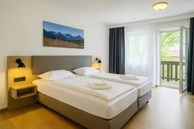 Ein Bett oder Betten in einem Zimmer der Unterkunft A8 Hotel im Darchinger Hof Bed & Breakfast - Zwischen Holzkirchen und Weyarn - Zwischen München Salzburg und Innsbruck - Kurz vor dem Irschenberg