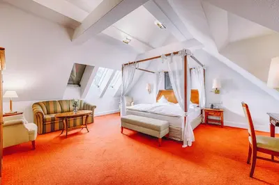 Ein Bett oder Betten in einem Zimmer der Unterkunft Hotel Moosburger Hof