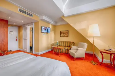 Ein Bett oder Betten in einem Zimmer der Unterkunft Hotel Moosburger Hof