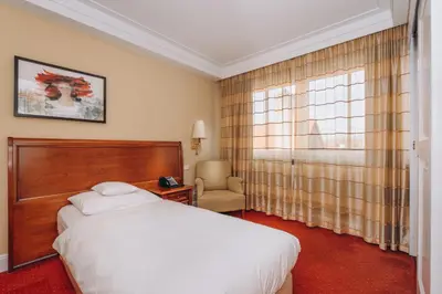 Ein Bett oder Betten in einem Zimmer der Unterkunft Hotel Moosburger Hof
