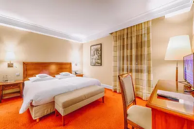 Ein Bett oder Betten in einem Zimmer der Unterkunft Hotel Moosburger Hof