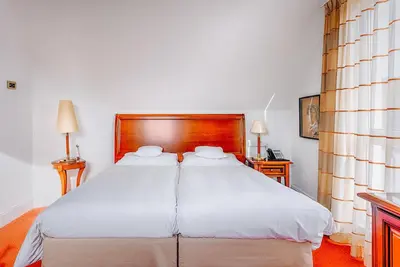 Ein Bett oder Betten in einem Zimmer der Unterkunft Hotel Moosburger Hof