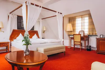 Ein Bett oder Betten in einem Zimmer der Unterkunft Hotel Moosburger Hof