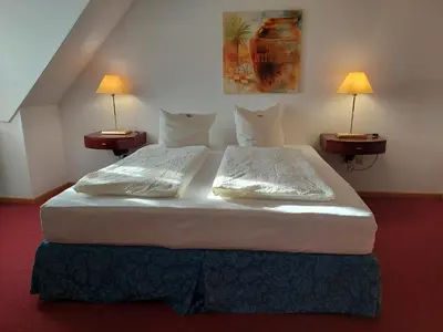 Ein Bett oder Betten in einem Zimmer der Unterkunft Der Heurige im Gasthaus zum Löwen
