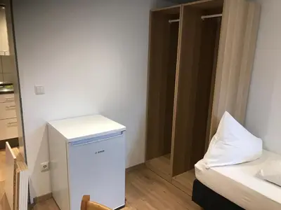 Ein Bett oder Betten in einem Zimmer der Unterkunft ZimmERding managed by Hotel Apfelbaum