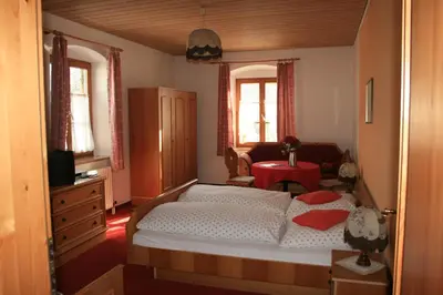Ein Bett oder Betten in einem Zimmer der Unterkunft Gasthaus zur Moosmühle