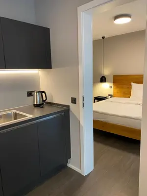 Ein Bett oder Betten in einem Zimmer der Unterkunft Timehouse Serviced Apartments
