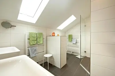 Ein Bett oder Betten in einem Zimmer der Unterkunft Gästehaus Alpina
